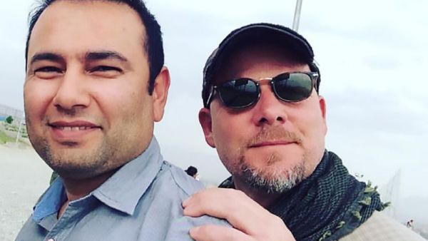 National Public Radio (NPR) photojournalist David Gilkey and Afghan journalist and interpreter Zabihullah Tamanna (L) pictured in Afghanistan on June 2, 2016. (AFP/File)