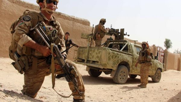 In this photograph taken on October 2, 2016, Afghan National Army commandos take position during a military operation in Helmand province. (AFP/Noor Mohammed)