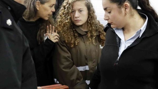 Israeli lawyer Gaby Lasky speaks with Ahed Tamimi, her client (AFP/File Photo)	