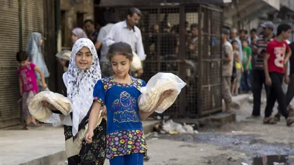 Syrian Children Stockpile Bread During the Siege of Aleppo (AFP)