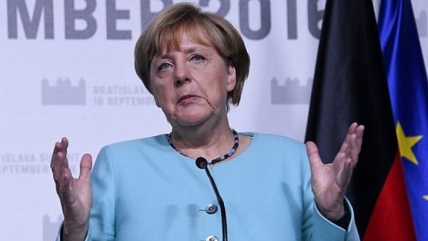 German Chancellor Angela Merkel delivers a joint statement with the French President after the European Union Summit of 27 heads of state or government. (AFP/File)