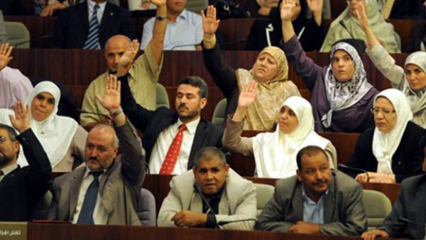 Algerian MP vote during a parliamentary session at the National Assembly in Algiers on October 1, 2012, to adopted an action plan for the new government, focusing on further political reforms in Algeria. (AFP/Farouk Batiche) 