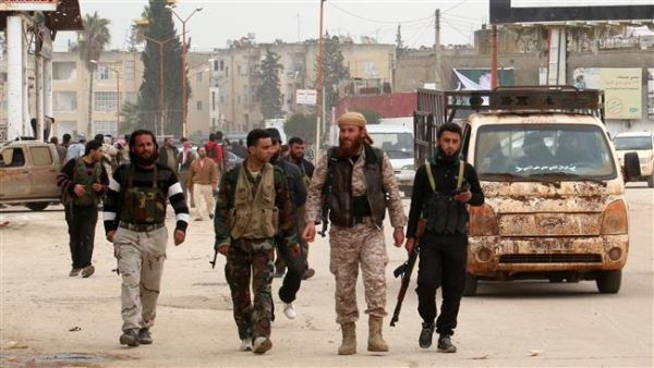 Foreign-backed militants patrol in the Syrian city of Idlib. (AFP/file)