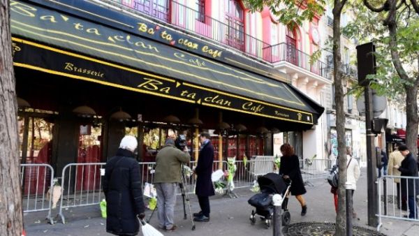 People walk in front of the Bataclan concert hall in Paris on November 11, 2016. (AFP/Miguel Medina)