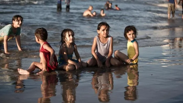 Palestinian children play on the beach in Gaza city. (AFP/File) 