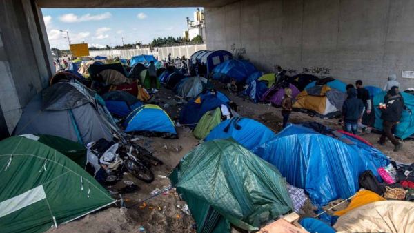 Migrant tents below a bridge in the Calais "Jungle." (AFP/Philippe Huguen)