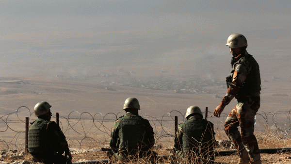 Iraqi Kurdish Peshmerga fighters hold a position on the top of Mount Zardak, about 25 kilometres east of Mosul.  (AFP/File) 