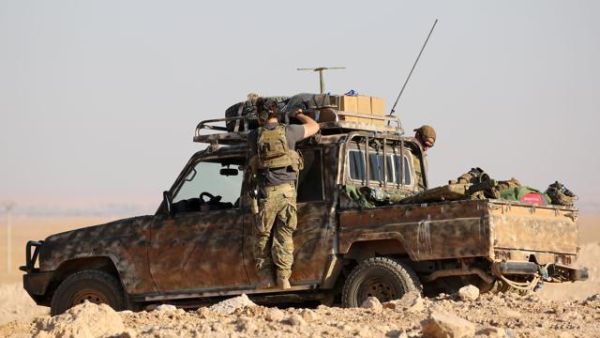 Members of US-backed Kurdish-Arab forces deploy on the frontline, one kilometre from the Syrian town of Ain Issa on Sunday as they launched an offensive on Raqqa.  (AFP/File)
