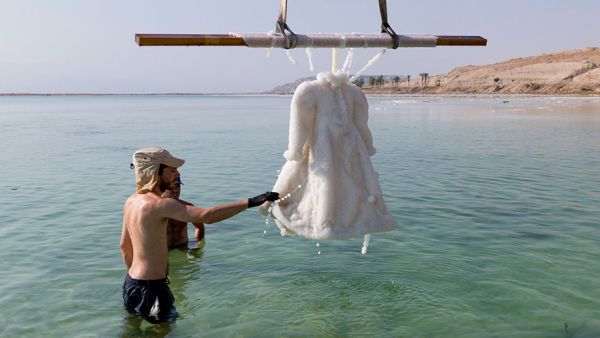 The dress is part of an eight part photography series by Israeli artist Sigalit Landau. (Twitter) 
