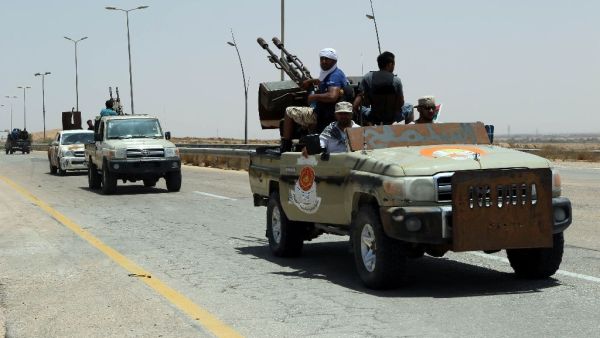 Forces loyal to Libya's UN-backed unity government patrol the entrance of Sirte as they advance to recapture the city from the Daesh group on June 10, 2016 (AFP/Mahmud Turkia)