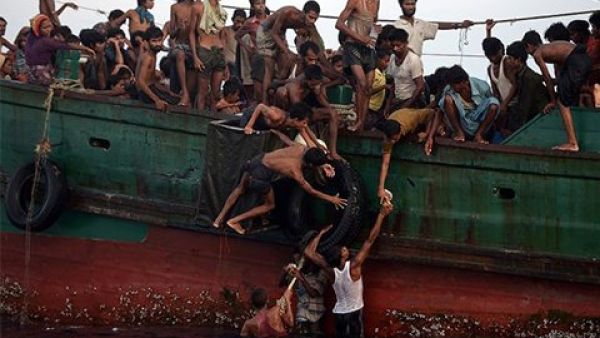 Rohingya stranded off the coast of Thailand in May. (Christophe Archambault/ AFP)