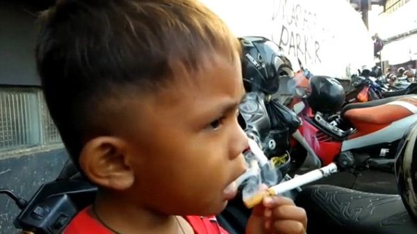 Two-year-old Rapi Ananda Pamungkas, from Sukabumi, Indonesia, (pictured) puffs through 40 cigarettes a day. (Social Media)
