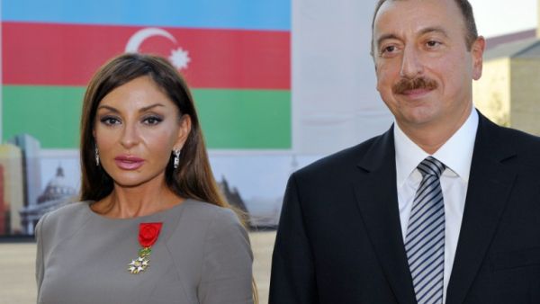 This file photo taken on October 7, 2011 shows Azerbaijan's President Ilham Aliyev (R) posing beside first lady Mehriban Aliyeva after she was awarded with the Legion d'Honneur medal by the French president in Baku. (AFP/Philippe Wojazer)
