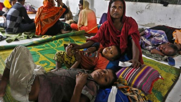 Bangladeshi villagers take refuge in a cyclone shelter following an evacuation by authorities in the coastal villages of the Cox's Bazar district on May 29, 2017 as Cyclone 'Mora' gradually approaches towards the coastline. (AFP/Stringer)