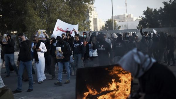 Bahraini protesters take part in a demonstration to mark the fifth anniversary of the Arab Spring-inspired uprising, on February 12, 2016, in the mainly Shiite village of Sitra, south of Manama. (AFP/Mohammed al-Shaikh)