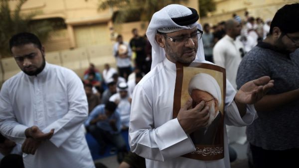Bahraini demonstrators attend a protest against the revocation of the citizenship of top Bahraini Shia cleric Sheikh Isa Qassim. (AFP/Mohammed Al-Shaikh)