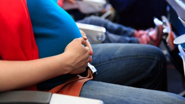 The mother-to-be was traveling home from Abu Dhabi, when the plane was diverted to Bahrain and she unexpectedly went into labor on the flight. (Shutterstock)