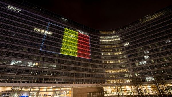 The Belgian flag is projected on the EU Commission building in tribute to the victims of Brussels following triple bomb attacks in the Belgian capital that killed about 35 people and left more than 200 people wounded. (AFP/Philippe Huguen) 