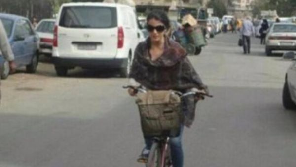 A woman bucks the establishment and rides a bike in Syria. (Syria Untold)