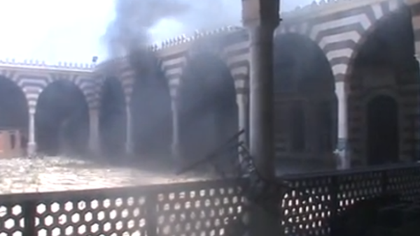 Khalid ibn al-Waleed mosque in Homs torched. (YouTube screen grab)