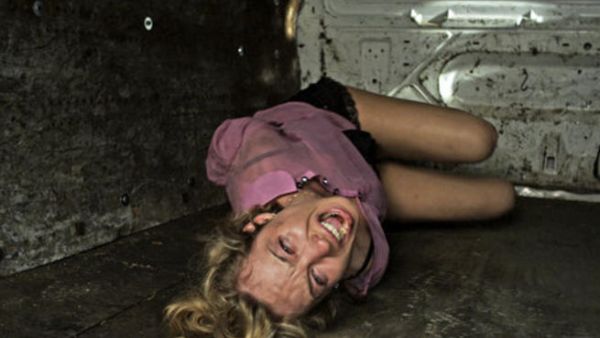 A blond-haired girl is kidnapped for international trafficking purposes and her Arab kidnapper has sympathy for her in 'Cargo'. (image courtesy of 1971 The Review AE )