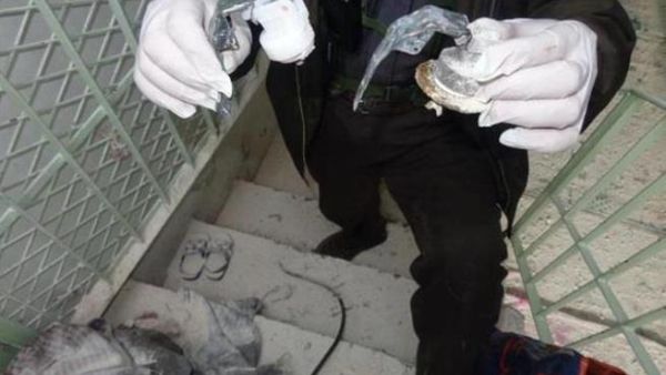 A Syrian reporter holds what he believes to be the remains of the canisters that held the poisonous gas dropped form helicopters onto the people of Saraqeb. ( image courtesy of Yalla Souriya )