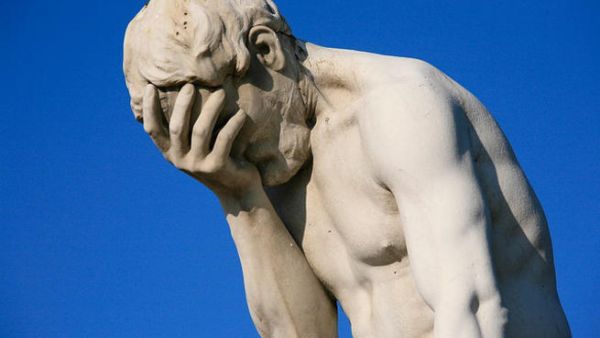 A statue illustrates a classic form of the #facepalm.