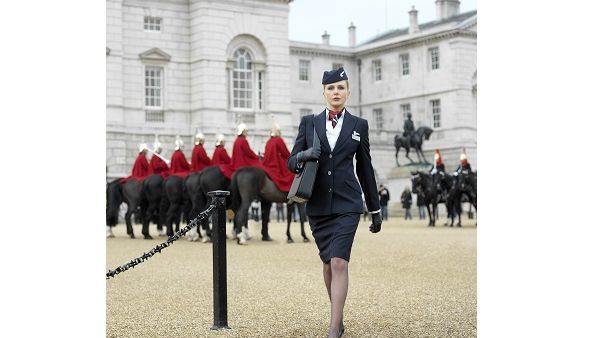 British Airways purser and The Royal Guard in London full-body.