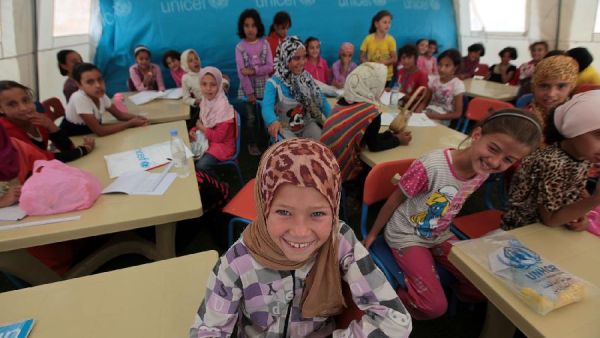 The Education Ministry plans to introduce double shifts at 102 schools where Syrian students are enrolled, bringing the total number of schools working on two shifts to 200. (File photo)