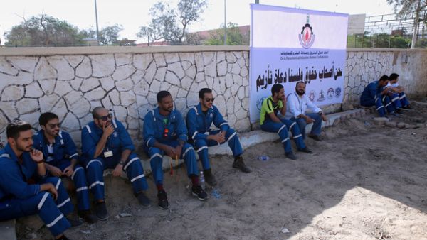 Kuwaiti oil workers at the union headquarters in Al-Ahmadi, 35 km south of Kuwait city.  (AFP/File)