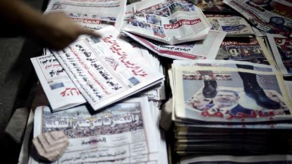 The harsh current economic circumstances forced Al-Ahram printing services to raise costs as most of the materials used in the printing operation are imported and must be paid for in dollars. (AFP/File)