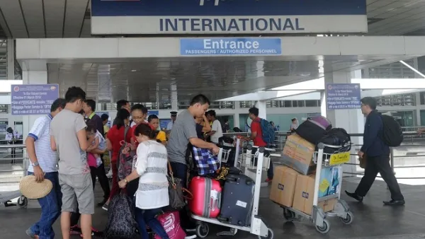 Passengers standing at the Philippine Airlines terminal at Manila International Airport on August 11, 2015. (AFP)