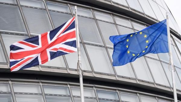 This file photo shows The British Union flag (L) and the European Union (EU) flag flying side-by-side outside City Hall, the headquarters of the Greater London Authority, in central London. (AFP/File)