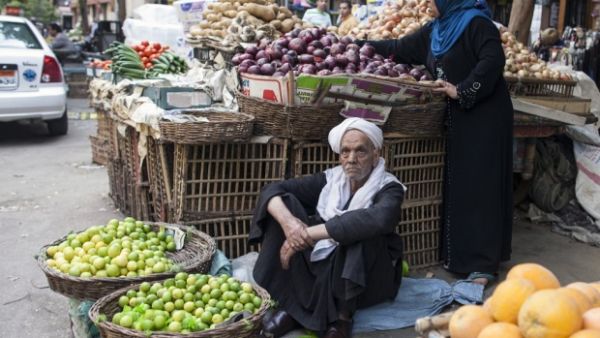 An Egyptian man sells fruits and vegetables at a traditional market in Cairo on May 7, 2014. (AFP/File)