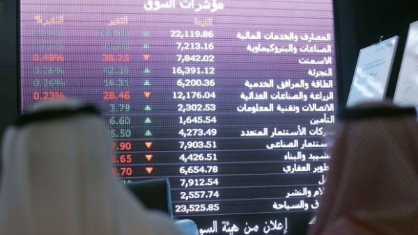 Investors monitor stocks at Saudi Arabia's National Commercial Bank. (AFP/File)