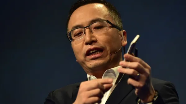 George Zhao, president of Honor, holds the newly introduced Honor 6X phone during the company's press conference at CES2017 in Las Vegas. (AFP/Frederic J. Brown)