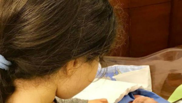 The mum-of-two uploaded on Instagram the first snap of her baby boy sleeping, with his older sister standing next him. (Source: cyrineanour - Instagram)