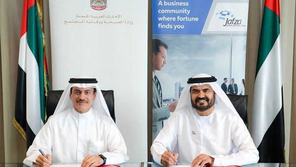 Dr. Amin Hussein Al Amiri and Mohammed Al Muallem Signing the MoU Dr. Amin Hussein Al Amiri and Mohammed Al Muallem Signing the MoU