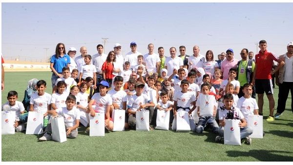 Prince Ali Bin Al Hussein surrounded by more than 200 girls and boys living in the camp during the opening ceremony on Tuesday September 12, 2017. Prince Ali Bin Al Hussein surrounded by more than 200 girls and boys living in the camp during the opening ceremony on Tuesday September 12, 2017.