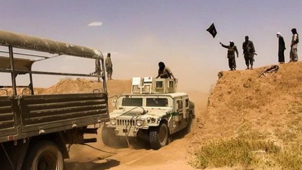 Daesh militants on a road at the Syrian-Iraqi border. (AFP/File)