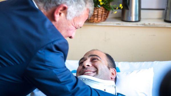 King Abdullah checks on security personnel injured in the Fuheis terrorist attack (Twitter)