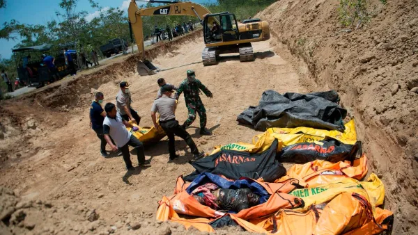 Appeal for international help as mass grave dug for 1,300 victims (Twitter)