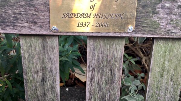 Photo shared by @nakedvix on Twitter of the bench that had a bronze plaque in commemoration of Saddam Hussein.