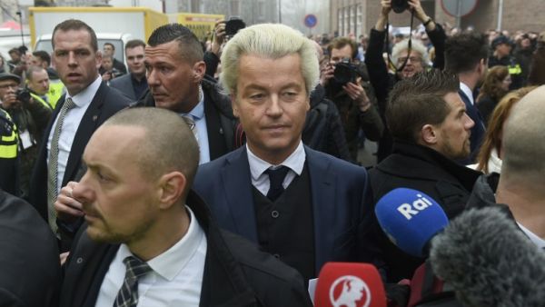 Dutch far-right politician and leader of the Partij Voor De Vrijheid (PVV or Freedom Party) Geert Wilders (C) looks towards journalists as he officially launches his parliamentary election campaign in Spijkenisse on February 18, 2017. (AFP/John Thys)