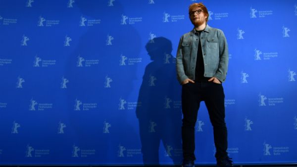 The 27 year old singer sparked rumors him and Cherry had already got hitched after he was spotted wearing a plain silver band on his ring finger. (Source: JOHN MACDOUGALL - AFP)