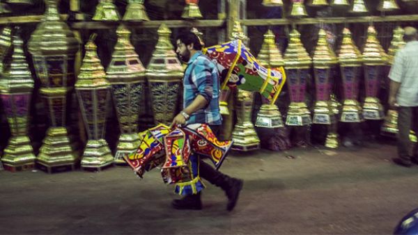 An Egyptian man carries traditional lanterns, known in Arabic as "Fanous", sold in Cairo during the Muslim holy month of Ramadan. (AFP/File)