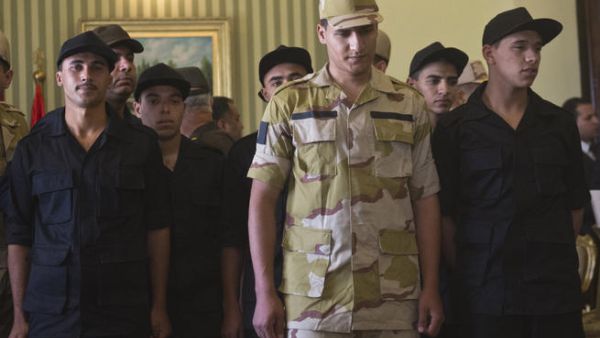 Egyptian police and soldiers who were seized in Sinai by kidnappers are seen upon their arrival at Almaza military Airbase in Cairo on May 22 (Khaled Desouki / AFP)