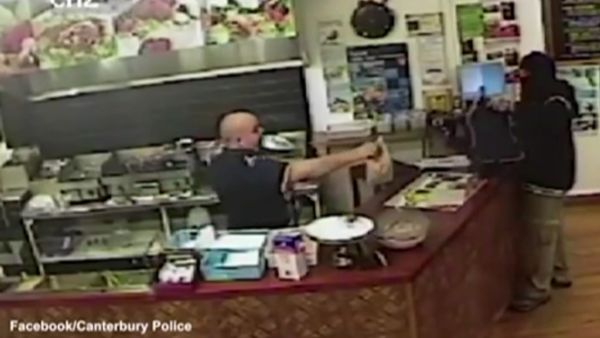 CCTV footage released by local police shows kebab shop owner Said Ahmed keeping his cool in front of an armed robber. (YouTube)
