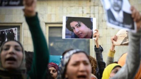 A woman holds a picture in Cairo on January 29, 2015 of Shaima al-Sabbagh during a demonstration against her killing by Egyptian police during a protest. (AFP/Mohamed al-Shahed) 