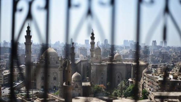 A mosque in Cairo is seen from behind the ancient Salaheddin citadel (AFP/ File)